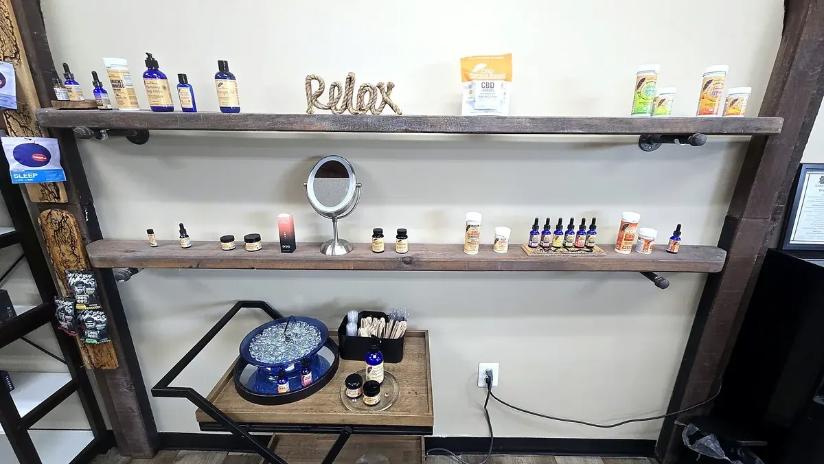 Shelves with a Relax sign at Renewed Wellness Mechanicsburg